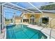 Enclosed pool and patio with ample space for outdoor dining and relaxation, overlooking the pool at 2598 Ekana Dr, Oviedo, FL 32765