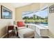 Relaxing sitting area featuring a comfortable chair, ottoman, and a view of the pool at 2598 Ekana Dr, Oviedo, FL 32765