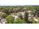 Aerial view of the property, showing mature trees and proximity to the city skyline at 2825 Mayer St, Orlando, FL 32806