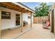 Cozy back patio with seating and a well-maintained concrete surface, perfect for outdoor relaxation at 2825 Mayer St, Orlando, FL 32806