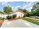 Inviting single-story home with a well-maintained front yard and a cozy carport, perfect for outdoor relaxation at 2825 Mayer St, Orlando, FL 32806