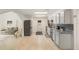 Open kitchen with modern appliances, granite countertops, and tile backsplash at 2825 Mayer St, Orlando, FL 32806
