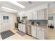 Renovated kitchen featuring stainless steel appliances and backsplash at 2825 Mayer St, Orlando, FL 32806