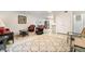 Living room with plenty of seating and an open concept to the kitchen at 2825 Mayer St, Orlando, FL 32806