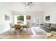 Bright living room with tile floors, white walls, ceiling fan and sliding doors to bring the outside in at 2825 Mayer St, Orlando, FL 32806