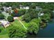 Beautiful lakefront property with mature trees, green space, and lovely landscaping in a desirable neighborhood at 2828 Whispering Way, Winter Park, FL 32792