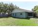 Side view of backyard and home, showing the large, grassy yard and windows at 2828 Whispering Way, Winter Park, FL 32792