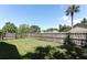 Fenced in back yard with green grass and privacy fence in suburban community at 2828 Whispering Way, Winter Park, FL 32792