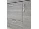 Close-up of bathroom cabinet with modern door handles at 2828 Whispering Way, Winter Park, FL 32792