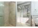 Bathroom featuring granite countertop, modern fixtures, walk-in shower and sliding glass door at 2828 Whispering Way, Winter Park, FL 32792