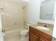 Cozy bathroom featuring a granite vanity and shower-tub combo at 2828 Whispering Way, Winter Park, FL 32792