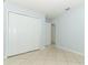 Bedroom with tile floors and closet at 2828 Whispering Way, Winter Park, FL 32792