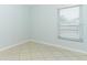Cozy bedroom with tiled floors and a window at 2828 Whispering Way, Winter Park, FL 32792