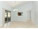 Bright dining room with patio access, open to kitchen through a pass-through at 2828 Whispering Way, Winter Park, FL 32792