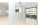 Dining area with sliding glass doors to the patio, open floor plan, and tile flooring throughout at 2828 Whispering Way, Winter Park, FL 32792