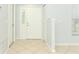 Home entryway featuring tile flooring, a front door with sidelight, and neutral walls at 2828 Whispering Way, Winter Park, FL 32792