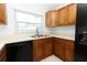 Bright kitchen with tile floors, wood cabinets, modern appliances, and ample counter space at 2828 Whispering Way, Winter Park, FL 32792