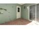 Charming patio featuring brick flooring and access to both a door and sliding glass door at 2828 Whispering Way, Winter Park, FL 32792