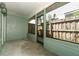View of the enclosed patio with green walls and fenced-in views of the back yard at 2828 Whispering Way, Winter Park, FL 32792