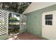 Cozy patio area with brick flooring, lattice accents, and a garden view, perfect for relaxing outdoors at 2828 Whispering Way, Winter Park, FL 32792