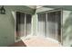 Enclosed patio with brick flooring and double sliding glass doors, creating a private outdoor living space at 2828 Whispering Way, Winter Park, FL 32792