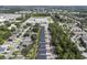 Aerial view showcases a well-planned neighborhood with neat rows of houses and lush green spaces at 2908 Lingo Ln, Orlando, FL 32822