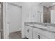 Modern bathroom with double granite vanity, framed mirror, and a shower over the bath combo with tile surround at 2908 Lingo Ln, Orlando, FL 32822
