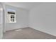 Bedroom with neutral paint, carpet, and a window, creating a bright and cozy space at 2908 Lingo Ln, Orlando, FL 32822