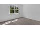 Cozy bedroom features a window with natural light, and plush carpeting, creating a comfortable atmosphere at 2908 Lingo Ln, Orlando, FL 32822