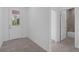 Bright entryway featuring tile floors and an inviting door leading to the outdoors and adjacent bathroom at 2908 Lingo Ln, Orlando, FL 32822