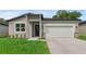 Charming single-story home featuring a two-car garage and modern architectural details at 2908 Lingo Ln, Orlando, FL 32822