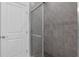 Modern shower with glass door, tiled surround, and neutral color palette at 2908 Lingo Ln, Orlando, FL 32822