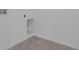 Utility room with gray tile floors and easily accessible water and drain hookups for laundry appliances at 2908 Lingo Ln, Orlando, FL 32822