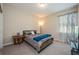 Cozy bedroom with soft carpet, natural light, and a minimalist design at 2938 Bushmead Ct, Ocoee, FL 34761