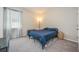 Well-lit bedroom with soft carpet, ample natural light, and minimalist decor at 2938 Bushmead Ct, Ocoee, FL 34761