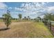 Spacious community dog park with a grassy area, seating, and secure fencing at 2938 Bushmead Ct, Ocoee, FL 34761