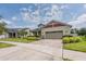 Charming home featuring a brick-paved driveway, manicured landscaping, and a two-car garage at 2938 Bushmead Ct, Ocoee, FL 34761