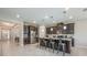 Spacious kitchen with granite counters, stainless appliances, and island with barstool seating at 2938 Bushmead Ct, Ocoee, FL 34761