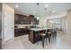 Large kitchen with a kitchen island, stainless steel appliances, breakfast bar, and eat-in kitchen at 2938 Bushmead Ct, Ocoee, FL 34761