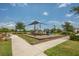 Neighborhood playground featuring a climbing structure, slide, and shade canopy at 2938 Bushmead Ct, Ocoee, FL 34761