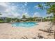 Community pool area with lounge chairs, a gazebo, and ample space for relaxation at 2938 Bushmead Ct, Ocoee, FL 34761