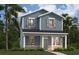 Charming two-story home featuring a covered front porch, blue siding, and lush landscaping at 305 Platform Ln, Debary, FL 32713