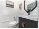 Modern bathroom featuring a stylish vanity, a black faucet, and elegant gold hardware at 3416 Grant Blvd, Orlando, FL 32804