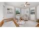 Bright Bedroom with a crib, rocking chair, and natural light from the windows at 3416 Grant Blvd, Orlando, FL 32804