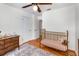 This Bedroom is well lit and has hardwood floors and an area rug at 3416 Grant Blvd, Orlando, FL 32804