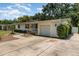 Charming single-story home featuring a well-manicured lawn, light yellow paint, and an inviting front porch at 3416 Grant Blvd, Orlando, FL 32804