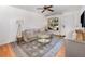 Bright living room with hardwood floors, modern decor, and a comfortable seating area at 3416 Grant Blvd, Orlando, FL 32804