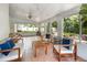 Bright sunroom features tile floors, light fixtures, and cozy seating areas at 3416 Grant Blvd, Orlando, FL 32804