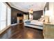 Primary bedroom featuring hard wood flooring, a king bed, fireplace, and ensuite bathroom at 3437 Coronet Ave, Orlando, FL 32833