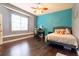 Bedroom featuring a bed, desk, and colorful decor, providing a comfortable and whimsical living space at 3437 Coronet Ave, Orlando, FL 32833